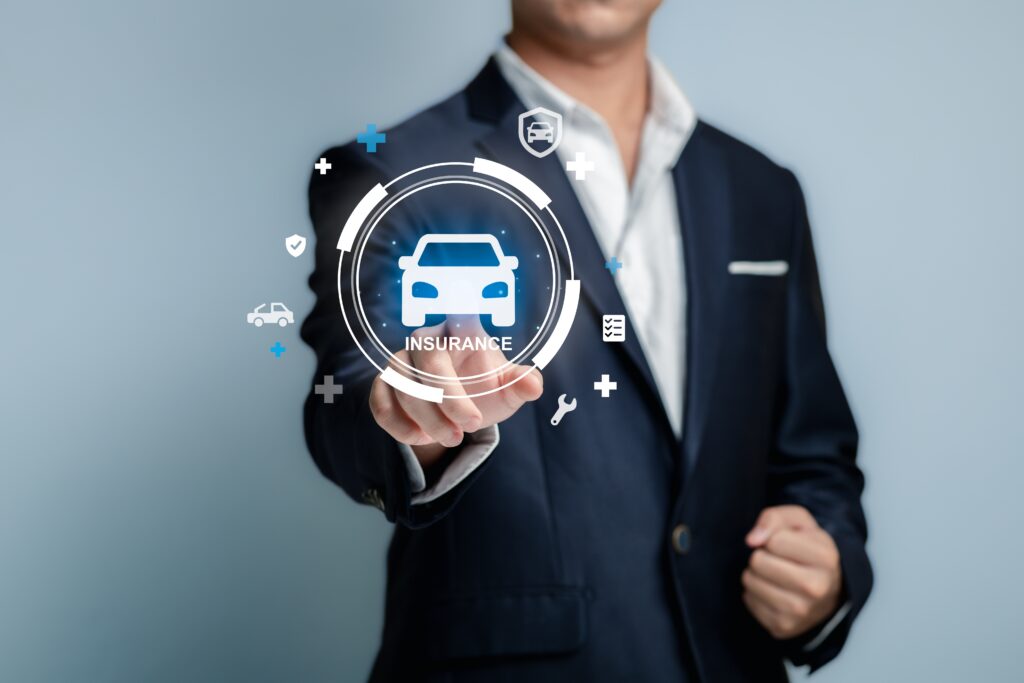 Insurance professional selecting a digital car insurance icon, representing how insurance adjusters assess fault after a car accident in Bakersfield.