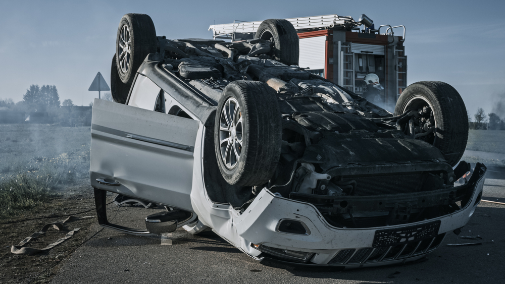 Overturned car after a serious accident which leads to psychological trauma like PTSD and anxiety symptoms