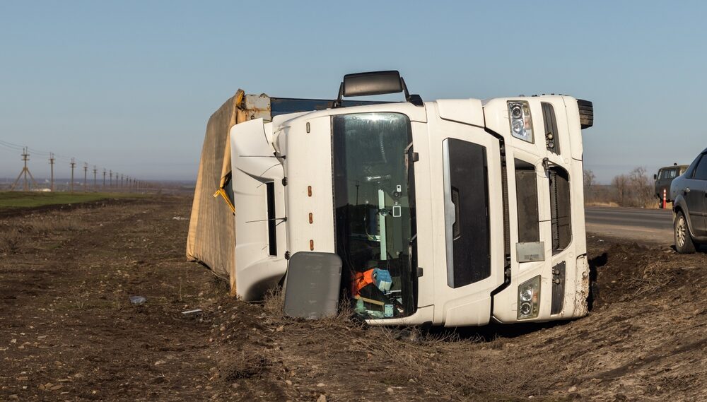 Overturned commercial truck on Bakersfield showing potential accident liability
