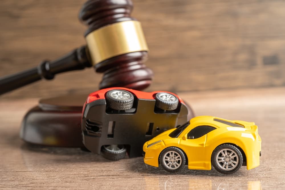 Hammer gavel judge with car vehicle accident, insurance coverage claim
