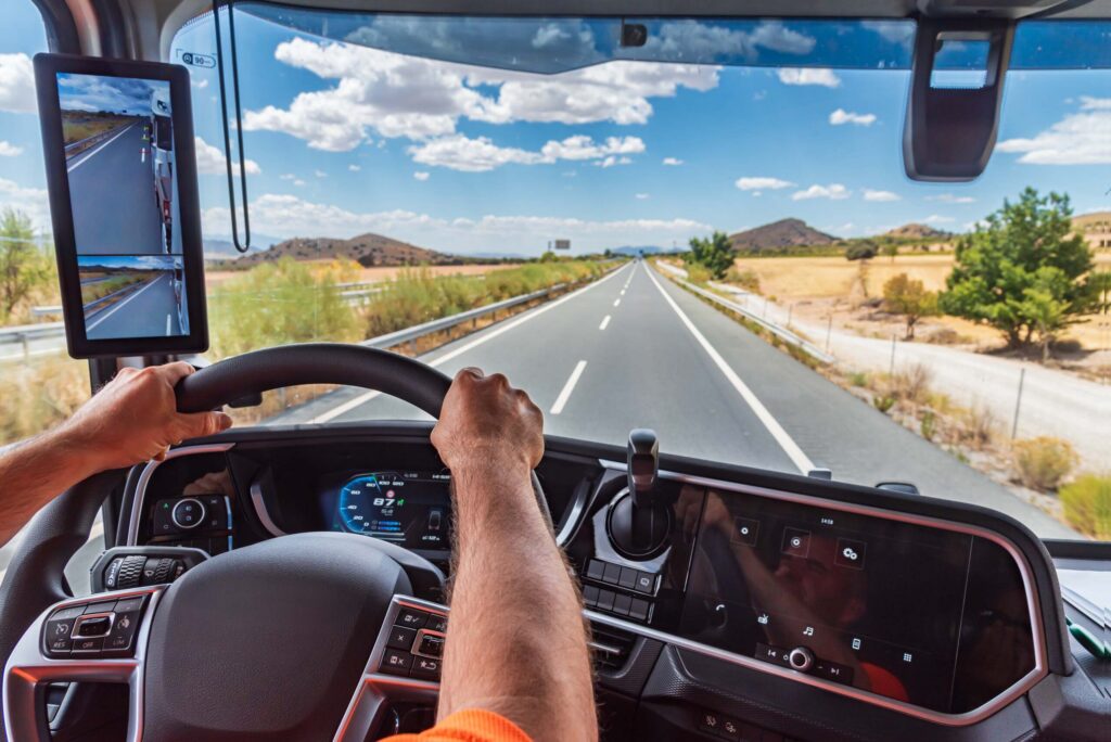 Truck driver transporting a tanker on a highway near Bakersfield, illustrating truck driver fatigue and hours-of-service rule violations