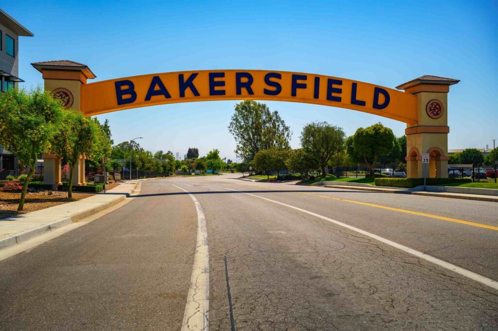 The yellow Bakersfield city arch over a local street, identifying the area for dangerous road and intersection analysis.