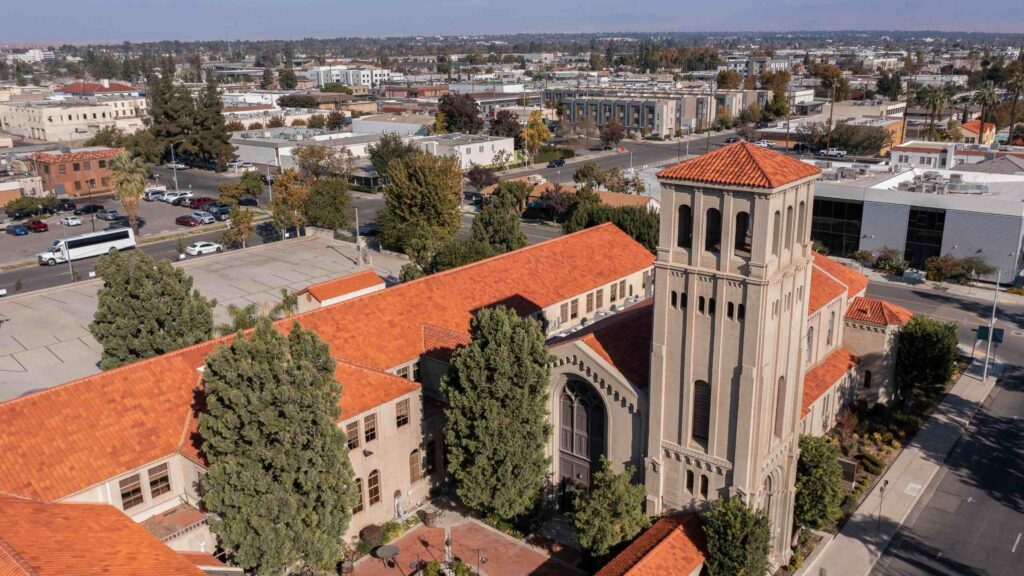 Aerial view of a historic building with a red-tiled roof in Bakersfield, representing local properties served by Bakersfield Premises Liability Lawyers.