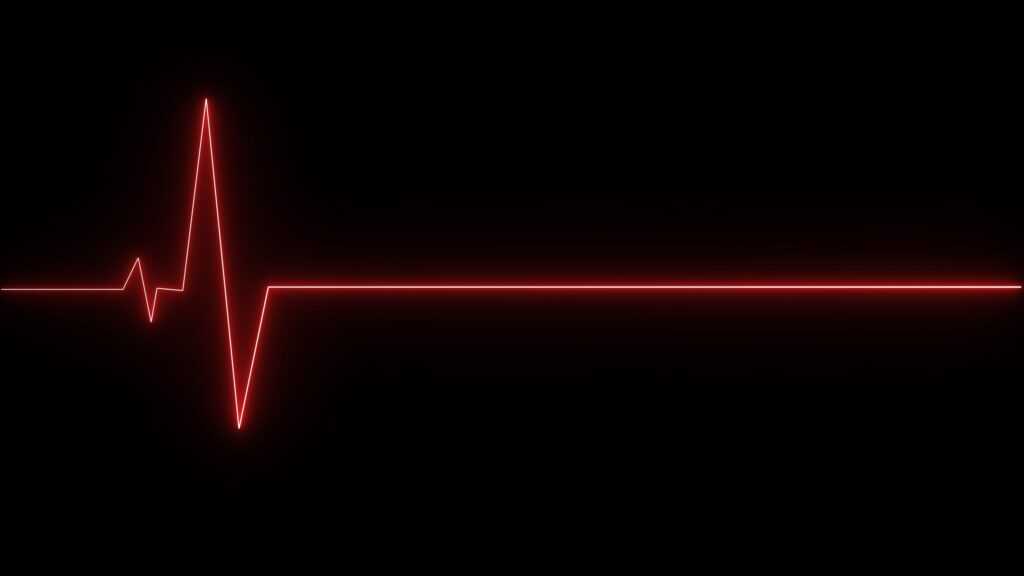 Heart rate monitor showing a red flatline illustrating how much is a wrongful death case worth in California.